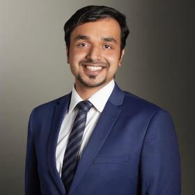 Ajay Krishna Manoj’s headshot.