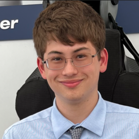 Joshua Meighan’s headshot.