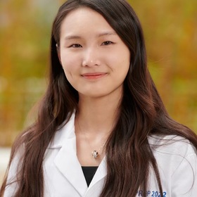 Jue Wang’s headshot.