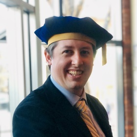 Tyler Roche’s headshot.