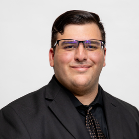 Dennis Theros’ headshot.