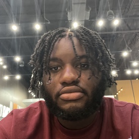 John-Thomas Sanganza’s headshot.