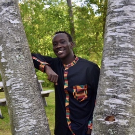 Brian Mokua’s headshot.