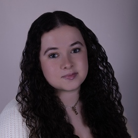 Esther Pustylnik’s headshot.