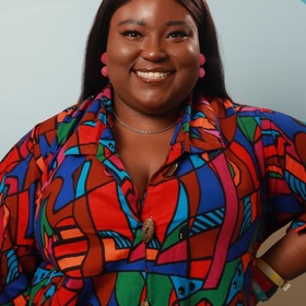 Sydney Rhodes’ headshot.