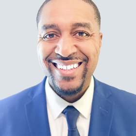 Brandon Riley’s headshot.