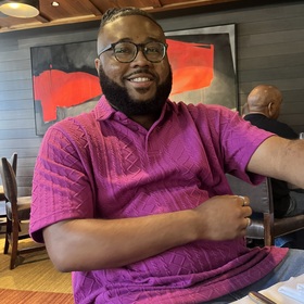 Joshua Grant’s headshot.