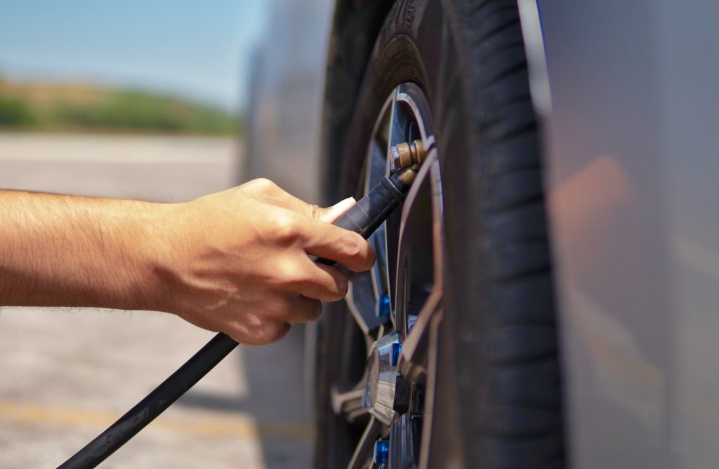 https://s3.amazonaws.com/rnrtires.com/wp-content/uploads/2026/08/10124403/inflating-car-tire-under-1MB-1024x669.jpg