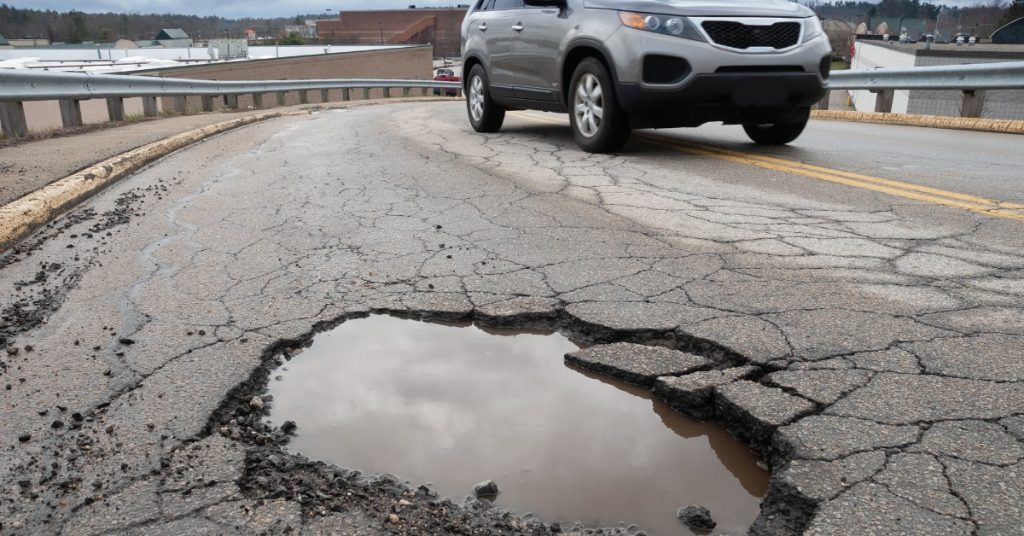 https://s3.amazonaws.com/rnrtires.com/wp-content/uploads/2026/09/21190550/457352-broken-asphalt-pothole-blogbanner1-1024x536.jpg