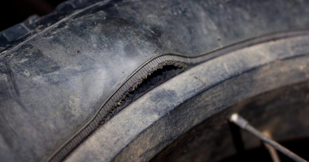 https://s3.amazonaws.com/rnrtires.com/wp-content/uploads/2026/09/21191249/457348-ruptured-bike-tire-BlogBanner1-1024x536.jpg