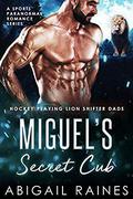 Miguel's Secret Cub: A Sports Paranormal Romance Series  (Hockey Playing Lion Shifter Dads) by Abigail Raines
