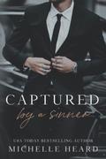 Captured By A Sinner by Michelle Heard