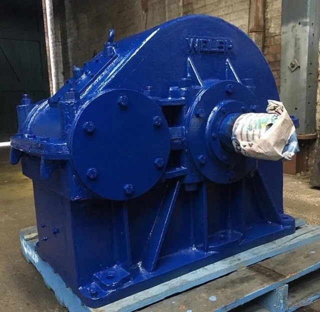 Are there specific guidelines or measurements to follow when adjusting gear mesh in a gearbox?