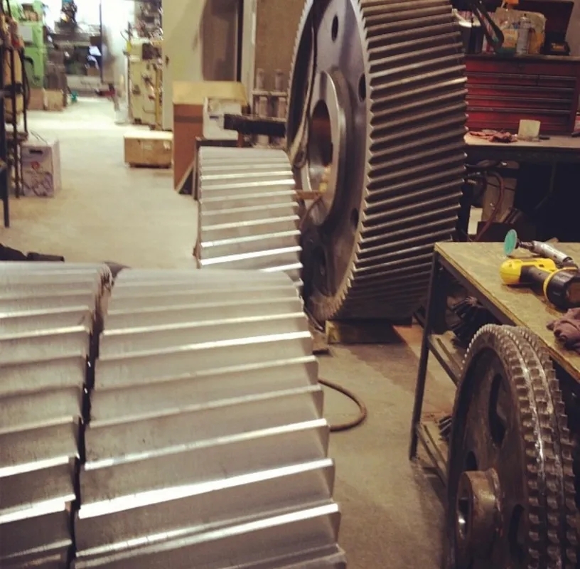 Are there any specific tools or equipment recommended for cleaning gearbox housing?