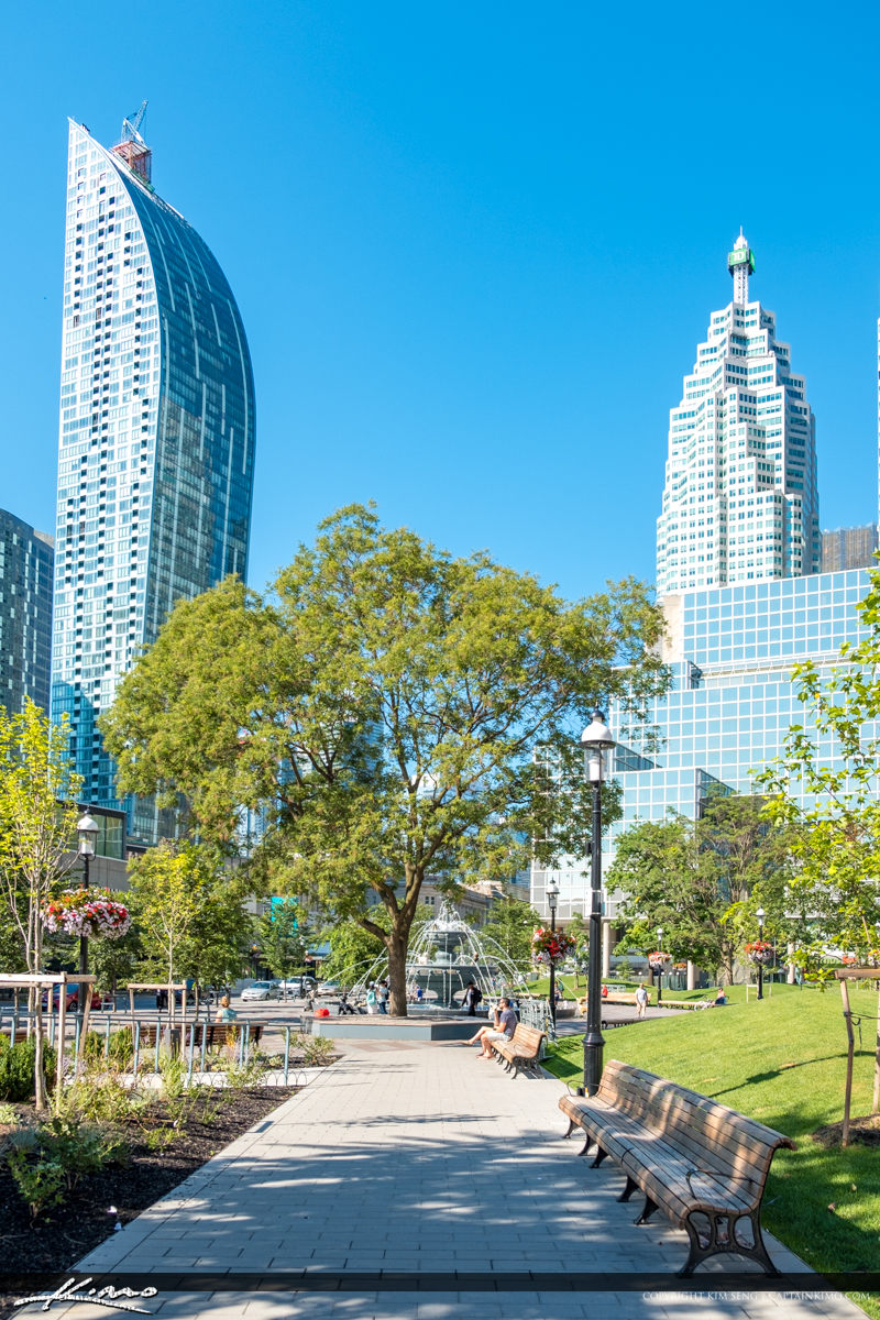 Skyline and Bench Berczy Park Toronto ON Canada Royal Stock Photo