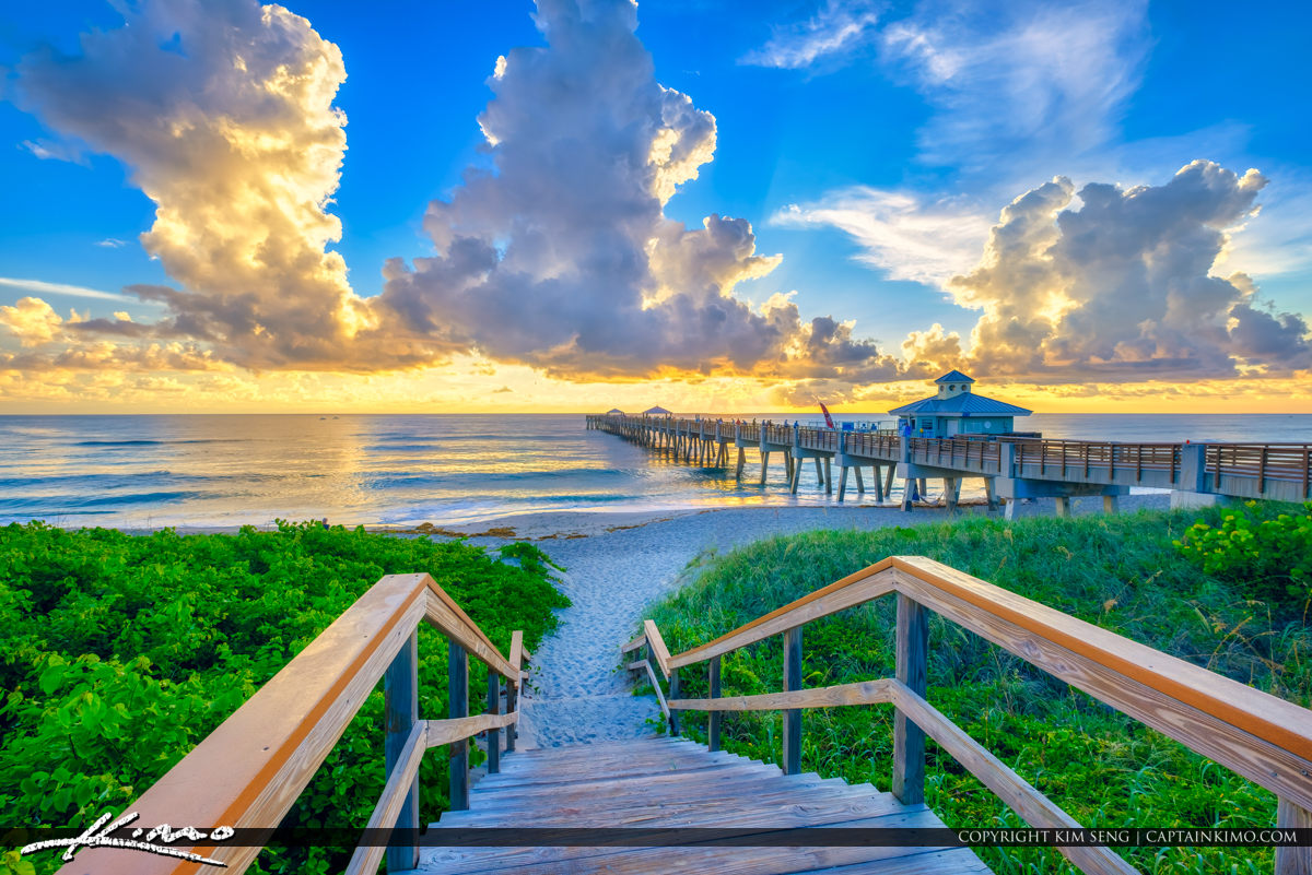 Juno Beach Pier Color and Clouds Over Atlantic Ocean Royal Stock Photo