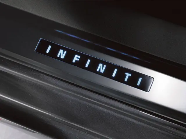 INFINITI Radiant Illuminated Kick Plates — glowing INFINITI logo, front doorsills