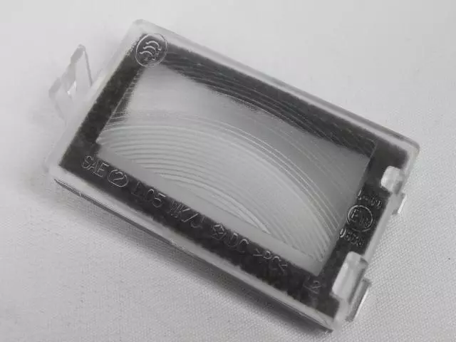 2005-2010 Jeep Grand Cherokee License Lamp Lens, Left 68020955AB
