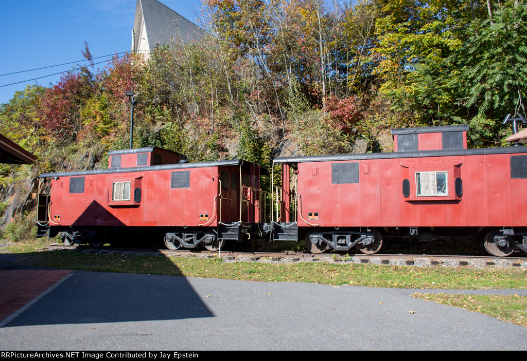 Cabooses on display next to the station
