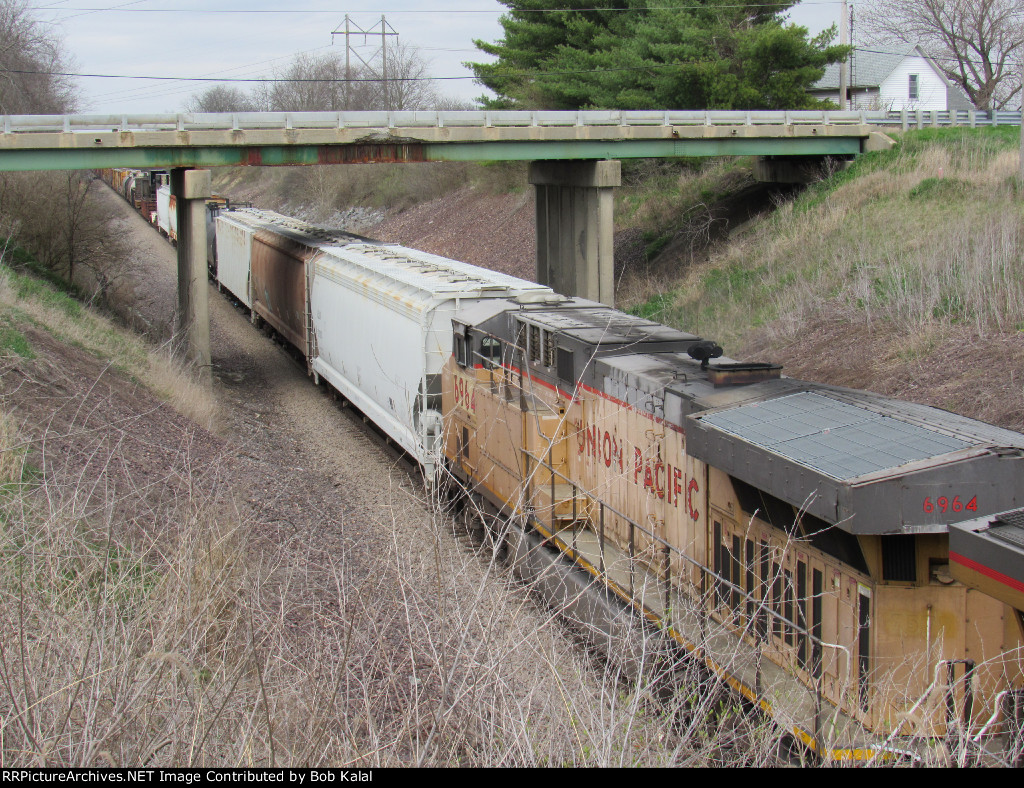 UP 2748 6964 Southbound towards Sidney under Cnty Rd 1000 Bridge