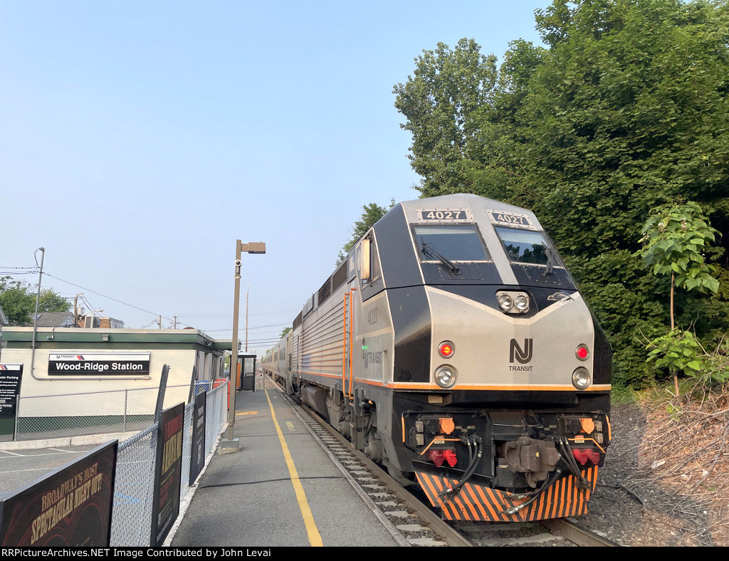 PL42AC # 4027 pushes NJT Train # 1604 out of the station.
