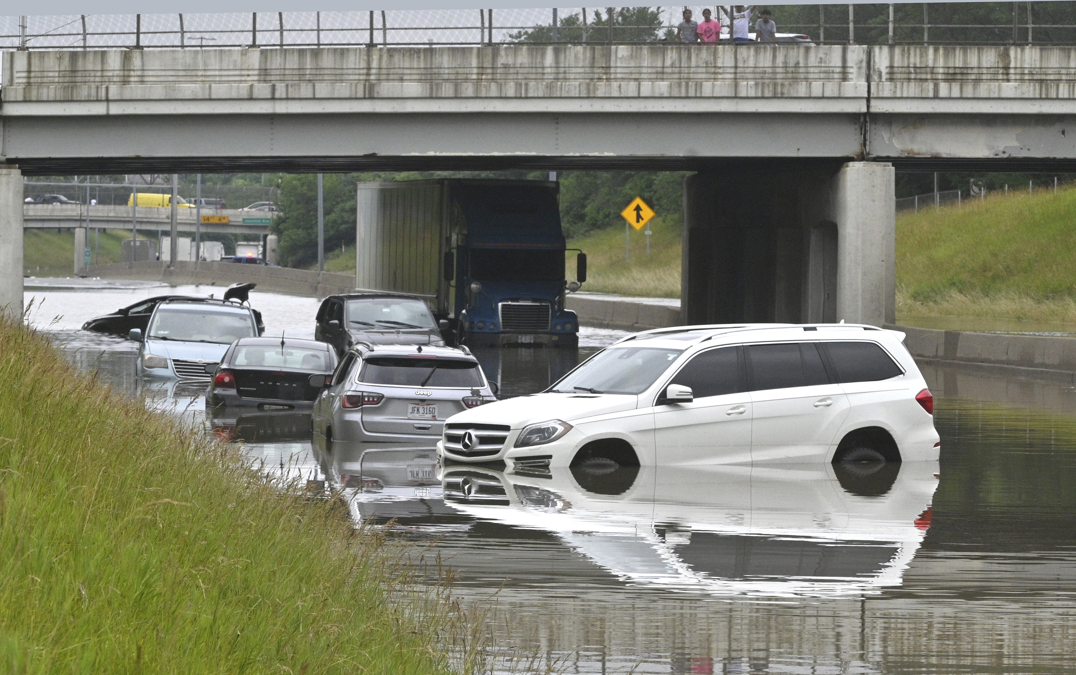 Cars sit in floodwaters on Interstate 94 at 30th Street in Detroit on Saturday, June 26, 2021 after heavy rain hit the metro area.
