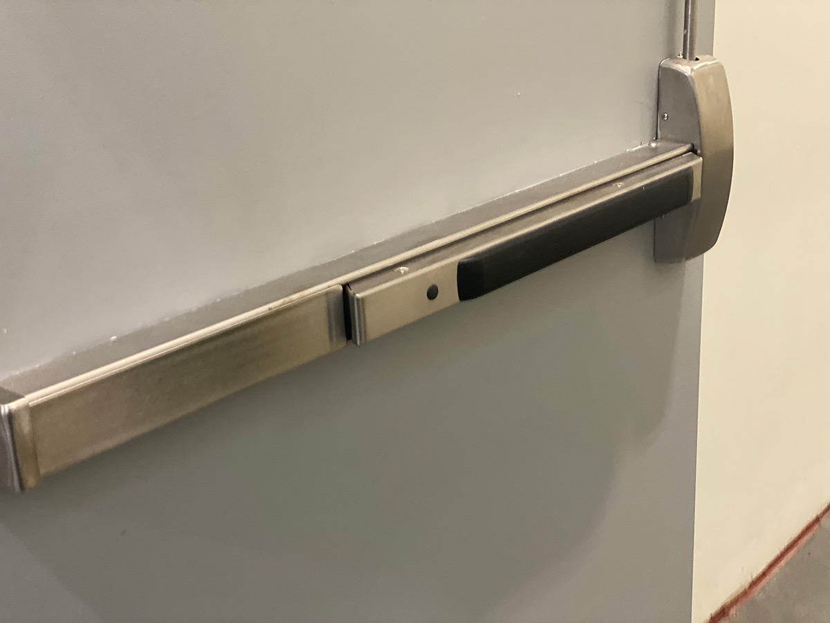 Alarmed Exit Device 8800 series vertical rod with a pull handle and key