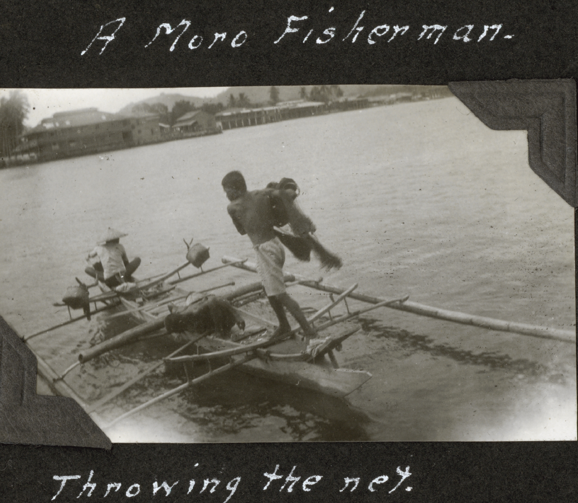 A Moro fisherman casting a net in the southern Philippines