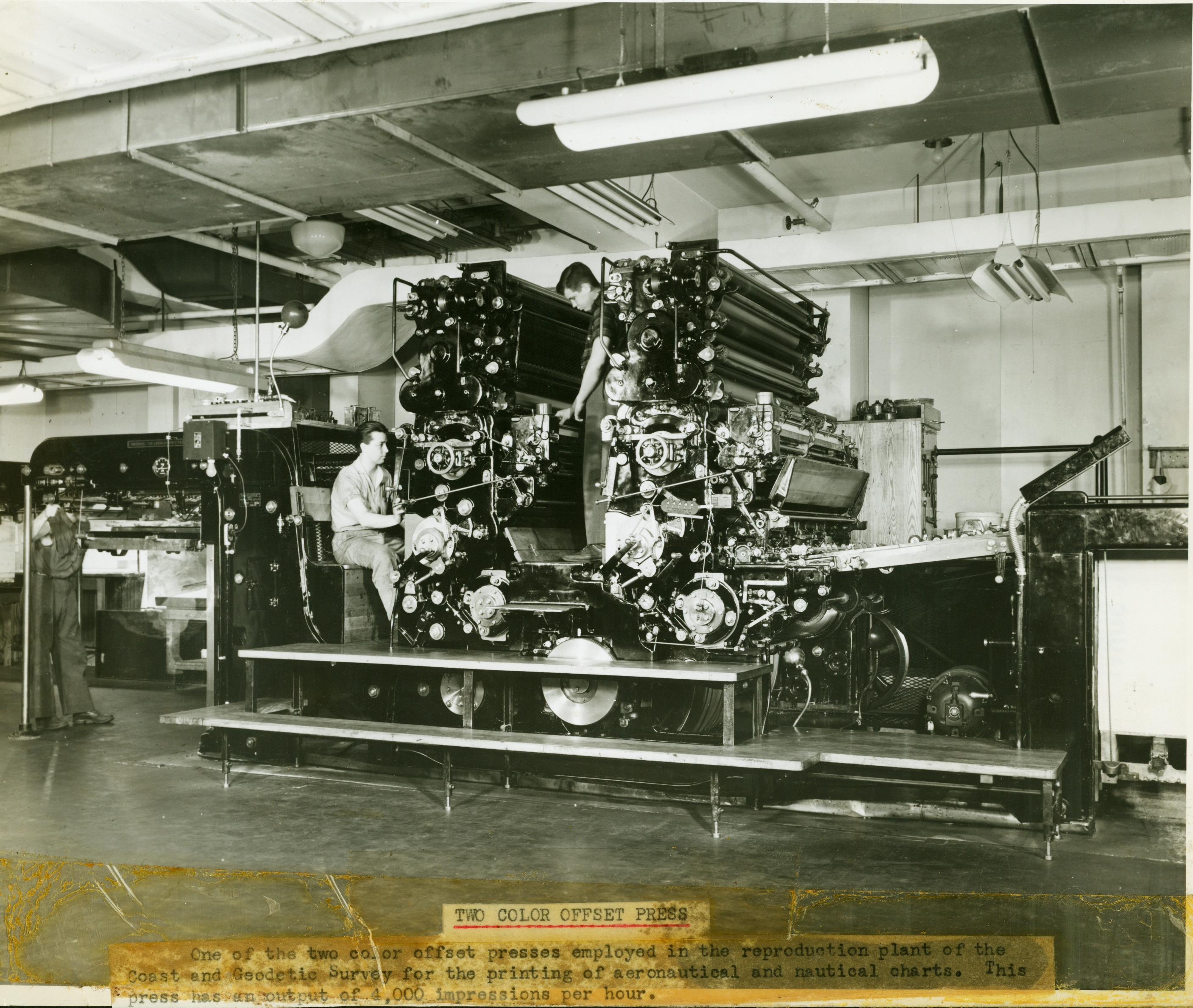 Harris presses in the press room in the basement of the Department of CommerceBuilding