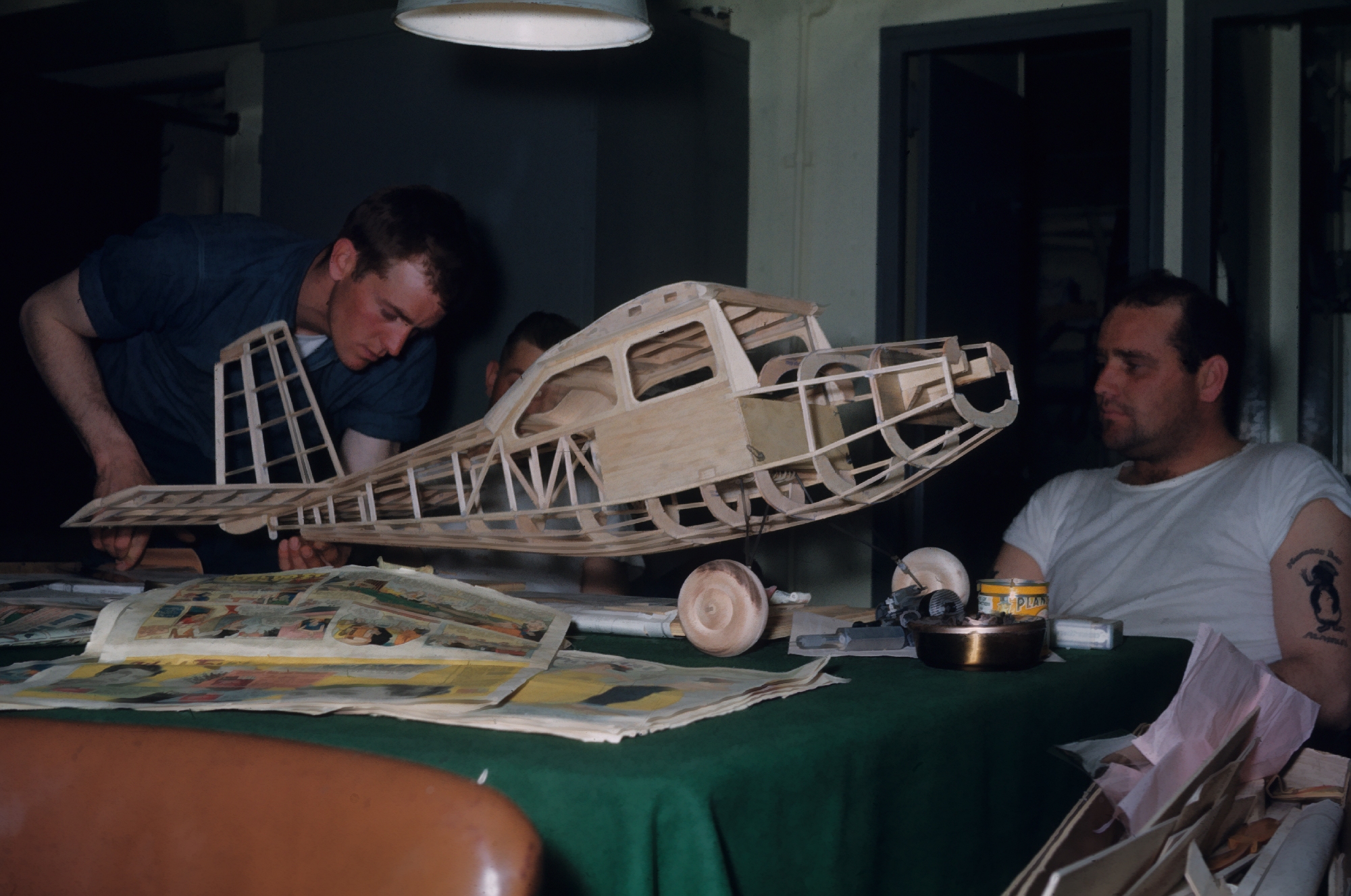 Model airplane under construction in the Petty Officers' lounge on thePATHFINDER