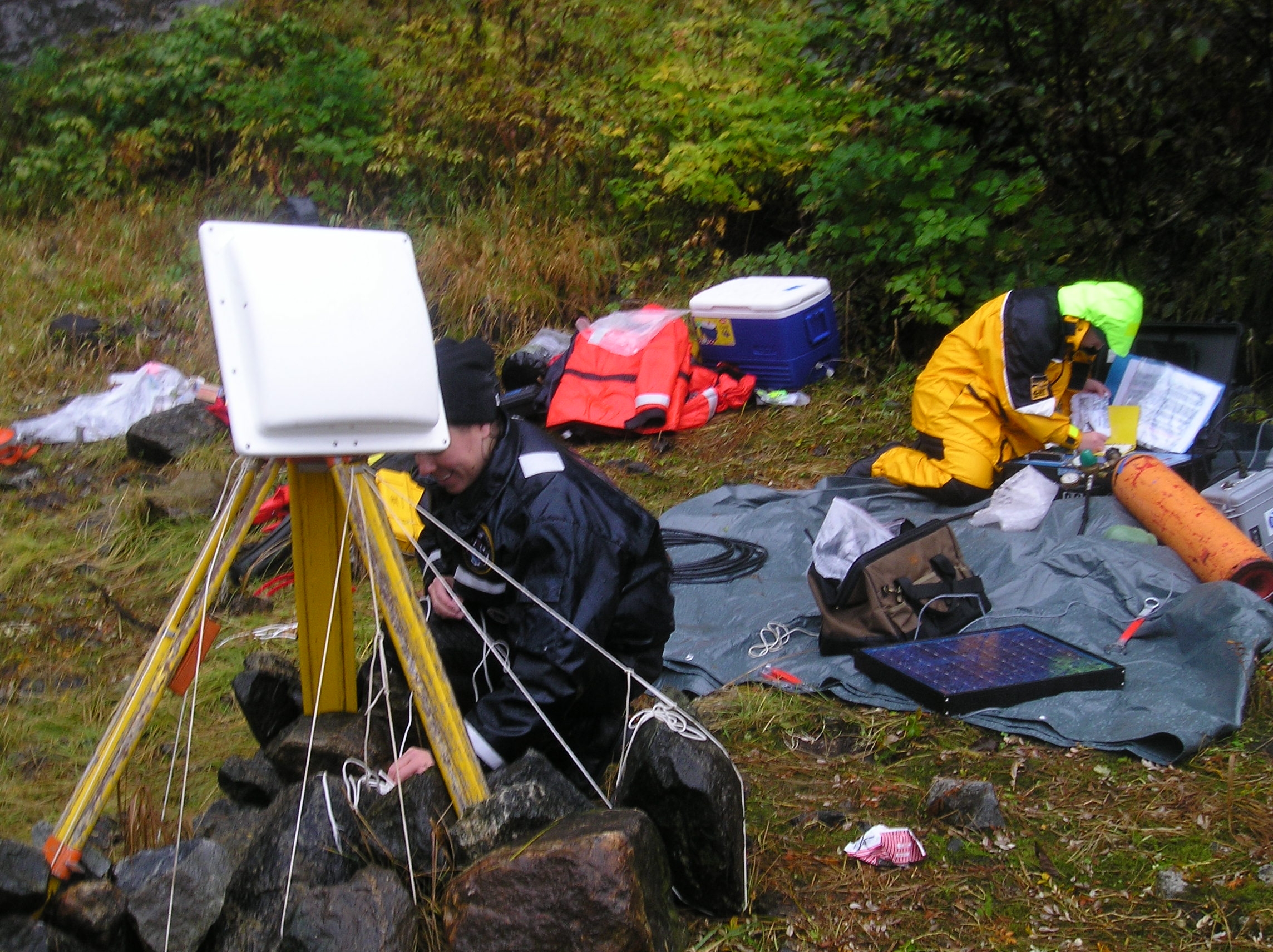 Setting up tide gauge equipment somewhere in Alaska