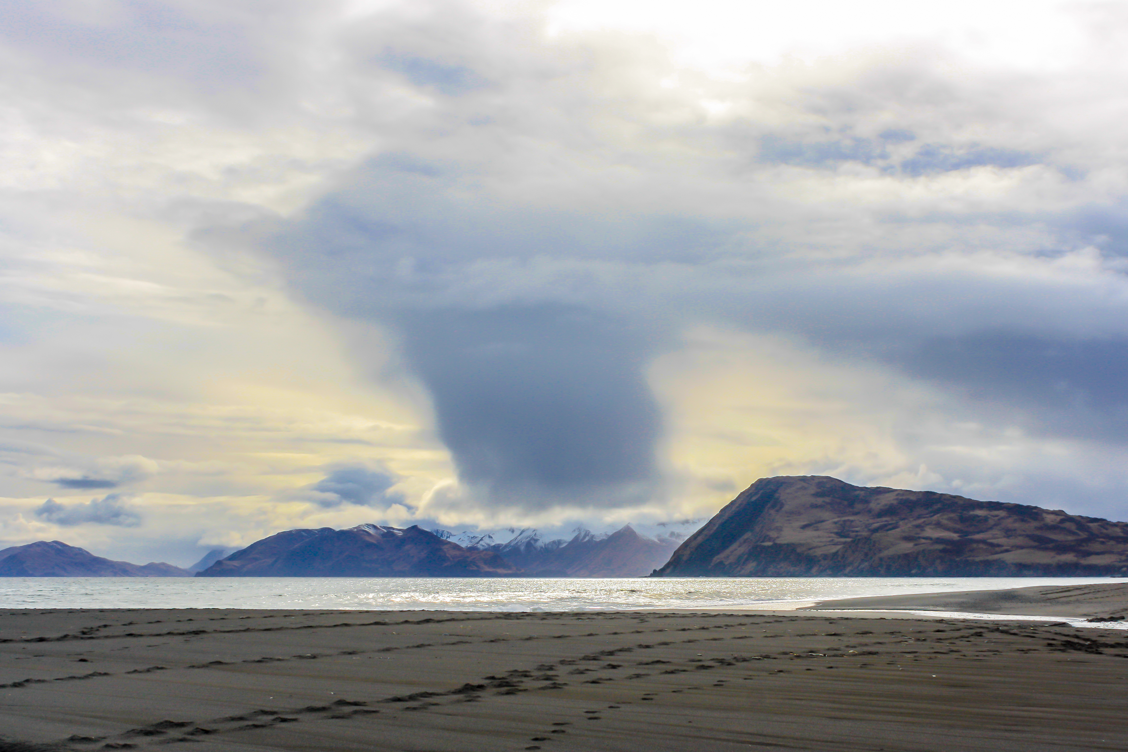A snow squall is about to touch down on the mountains of Kodiak Island