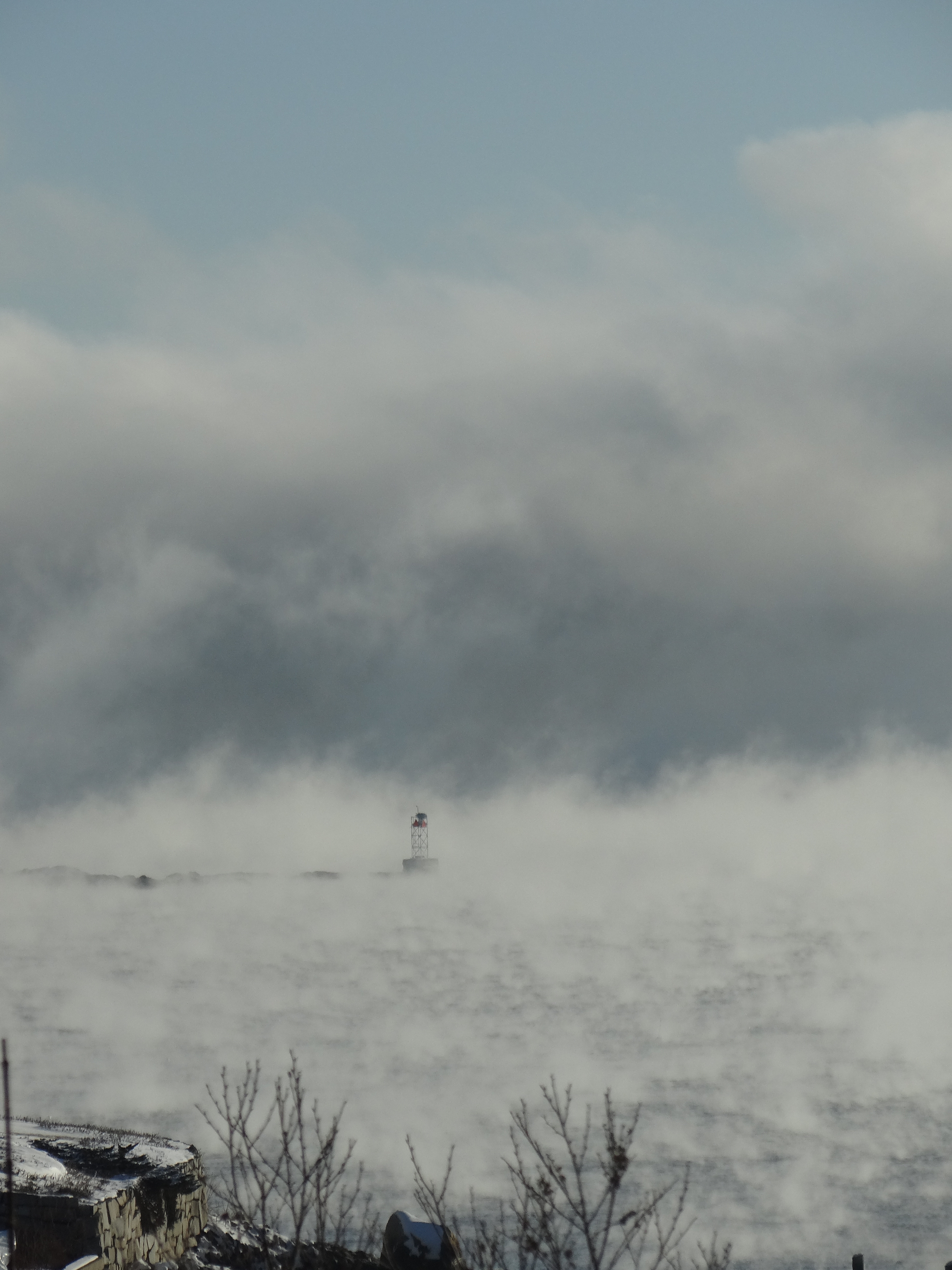 Winter morning Camden sea smoke circling Northeast Point LightWhite Skeleton Tower 