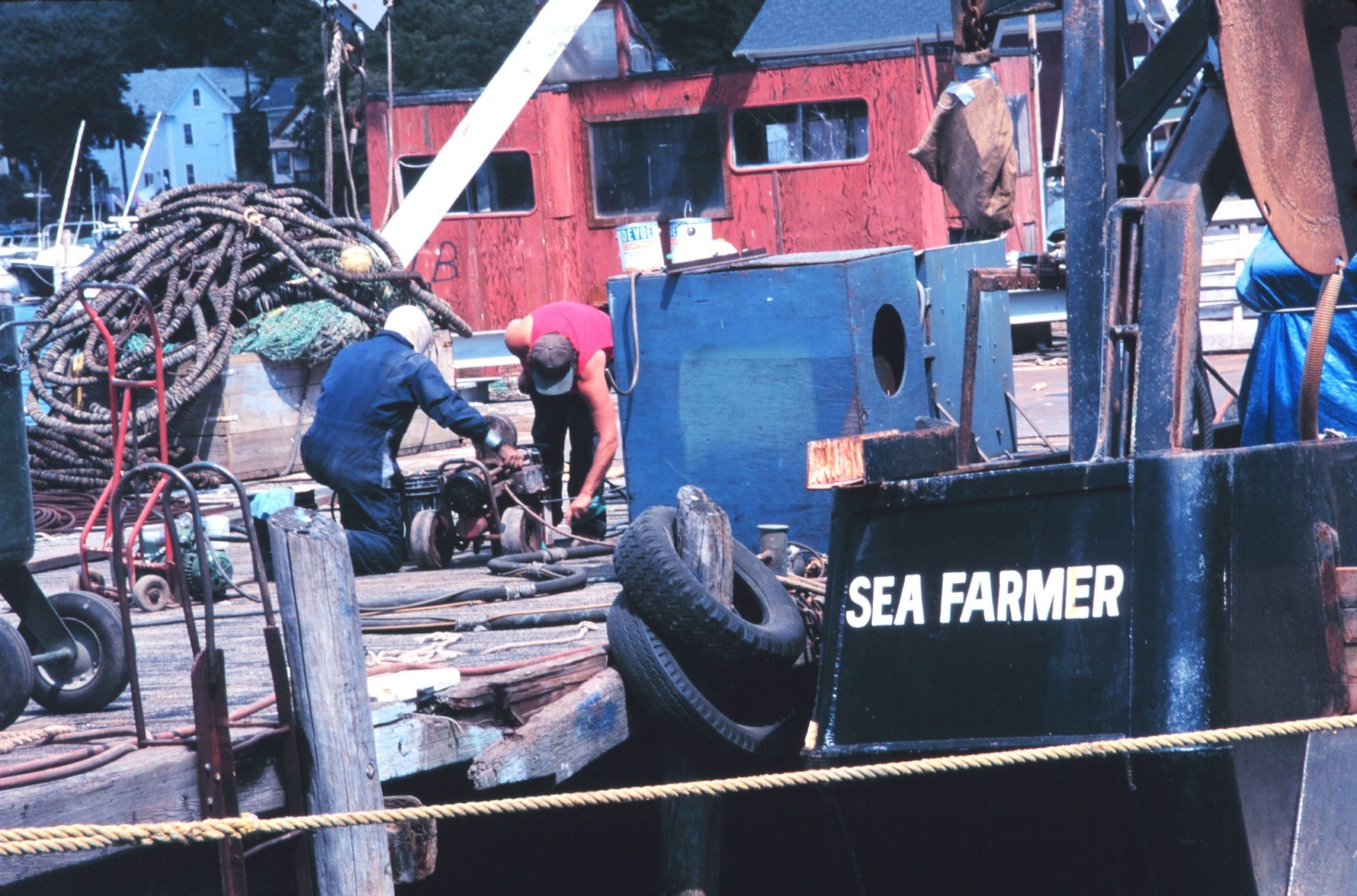 Fishermen maintaining gear on the dock
