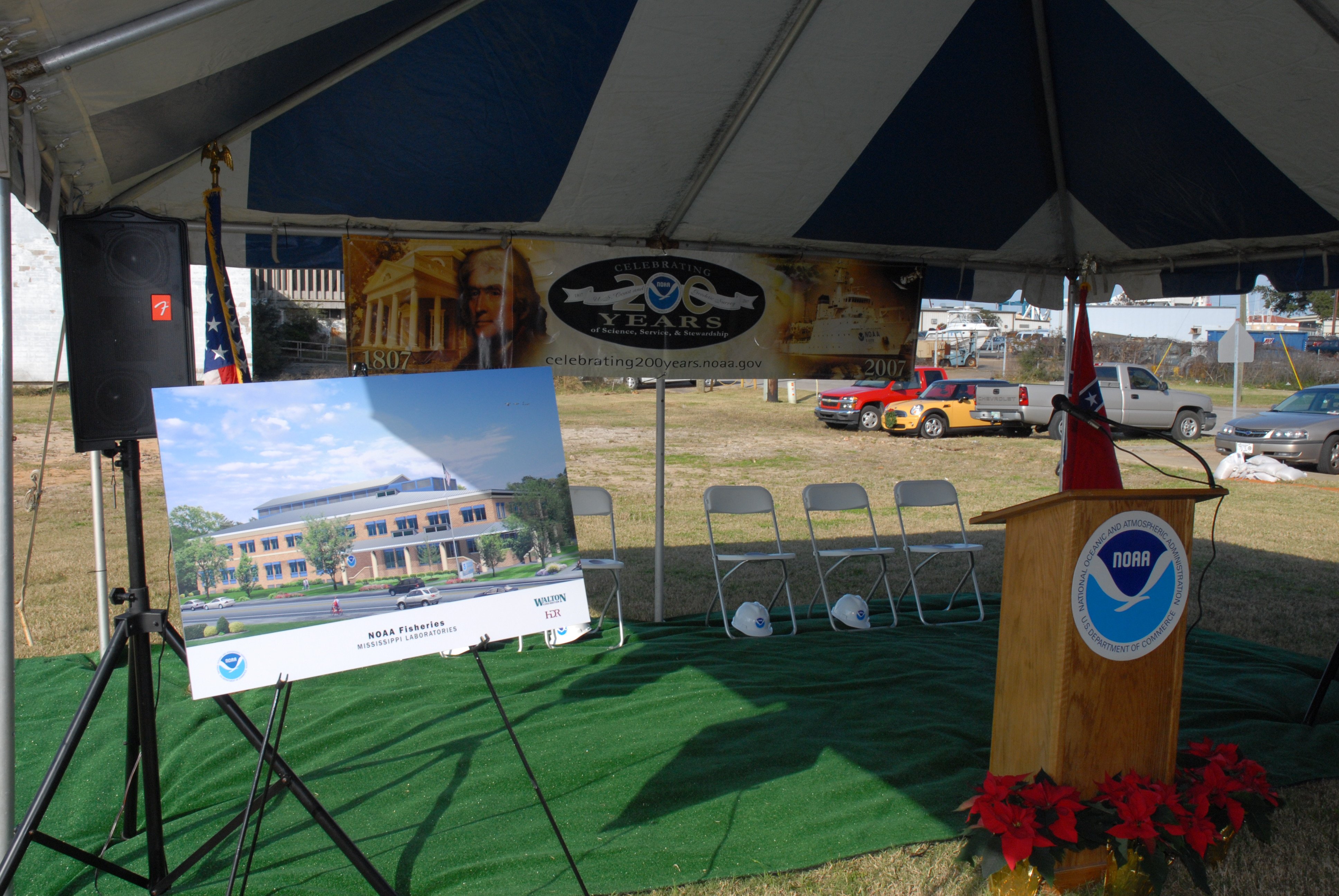 Tent and speakers stand at groundbreaking ceremony of new Pascagoulafisheries laboratory