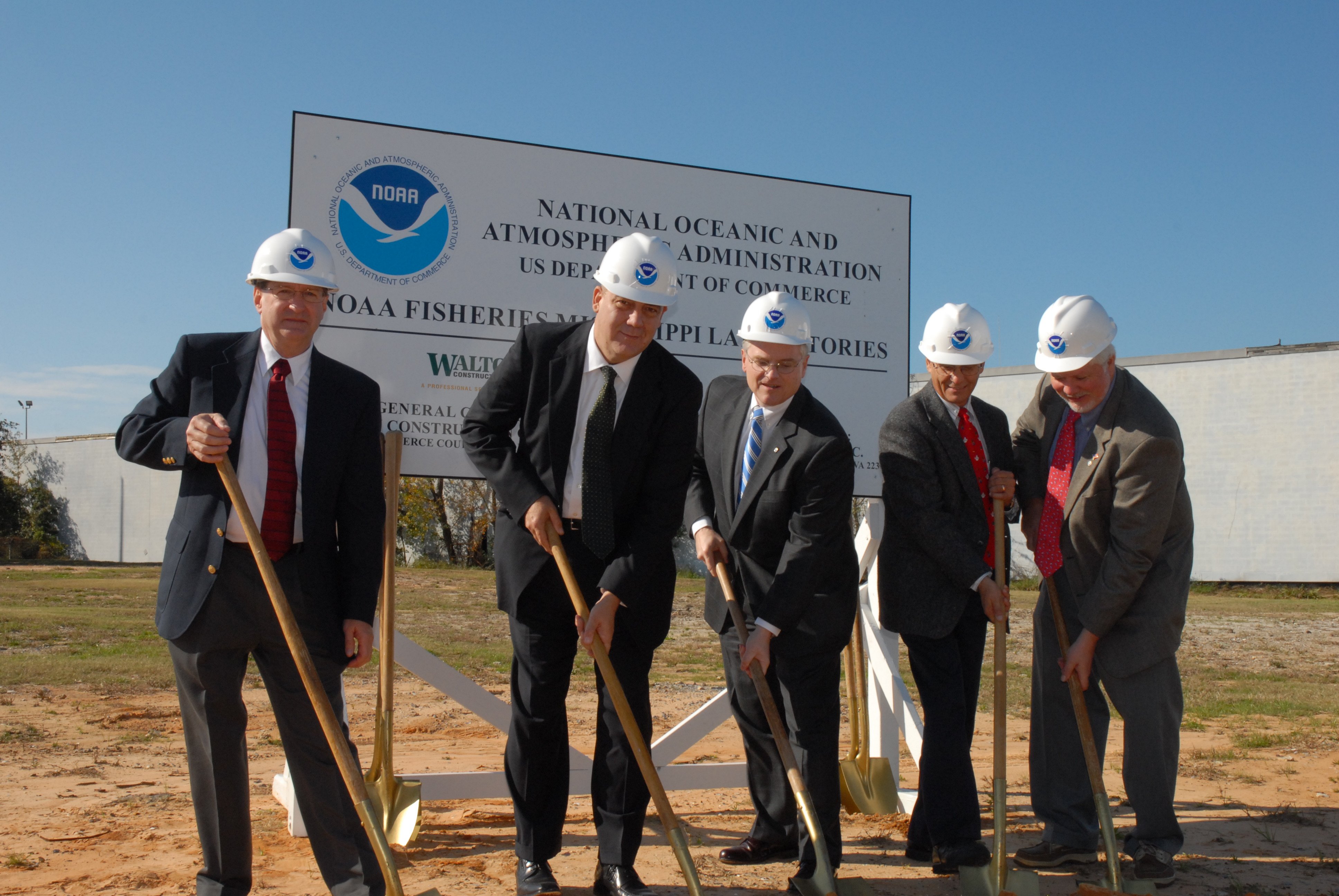 Deputy Assistant Administrator for NMFS, John Oliver, on right, and variousdignitaries at groundbreaking ceremony for new Pascagoula fisherieslaboratory
