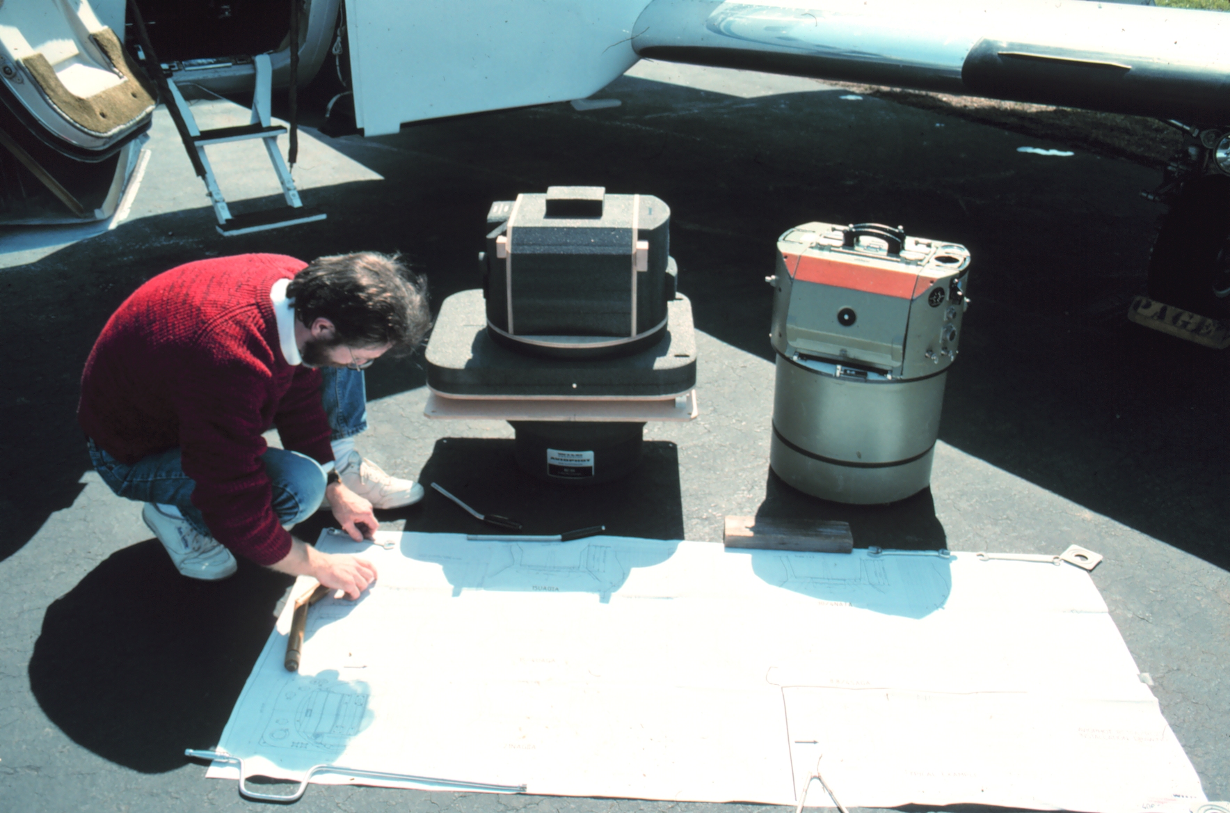 Photogrammetrist Bill Hawken preparing NOAA Cessna Citation II for mission