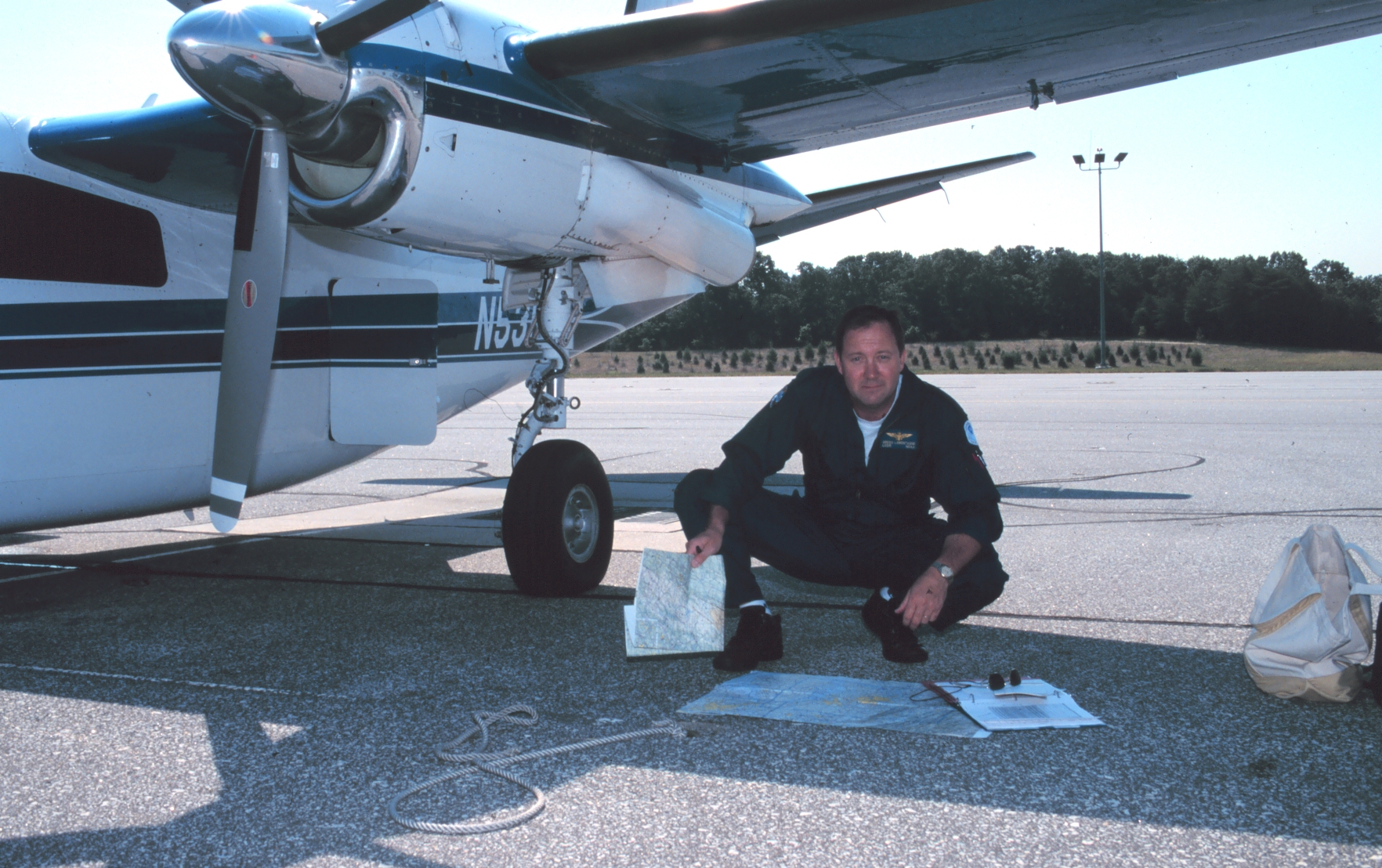Lieutenant Commander Greg LaMontagne planning aerial photographic mission onRockwell Turbo Commander N53RF