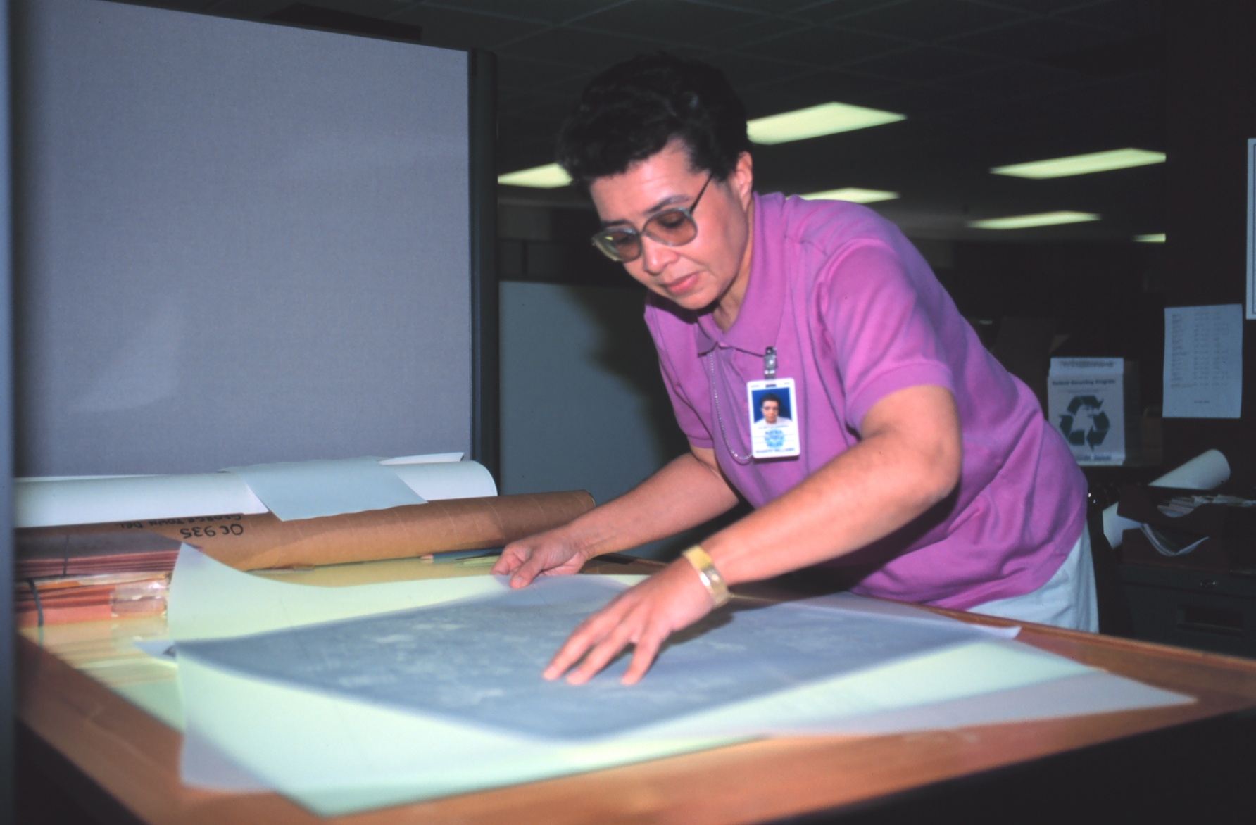 Helen Sharpe-Williams, a cartographer with the National Geodetic Survey RemoteSensing Division working with aerial photographs