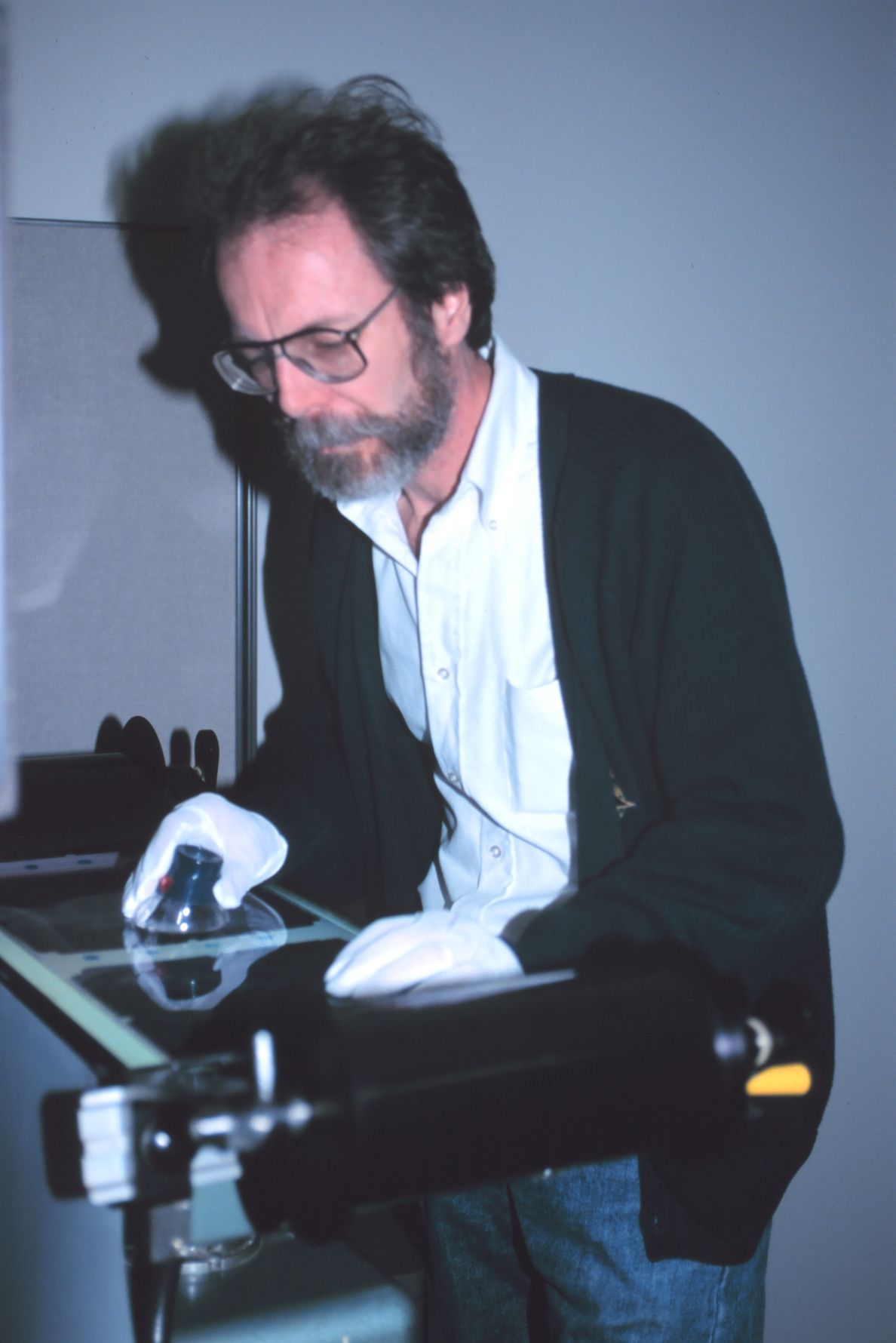 William Hawken, a photographer with the National Geodetic Survey Remote Division reviewing film