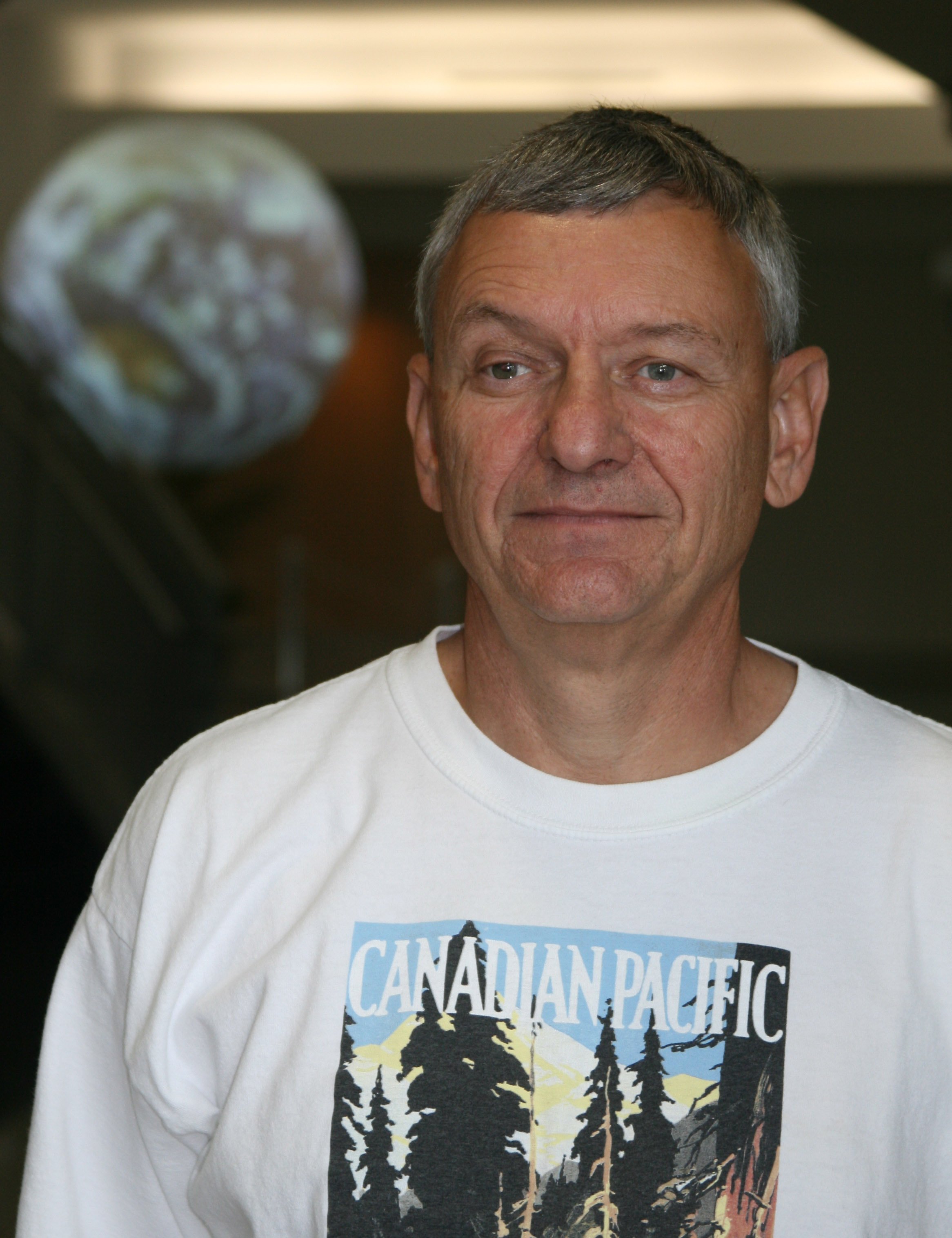 Don Burgess with Science on a Sphere in the background