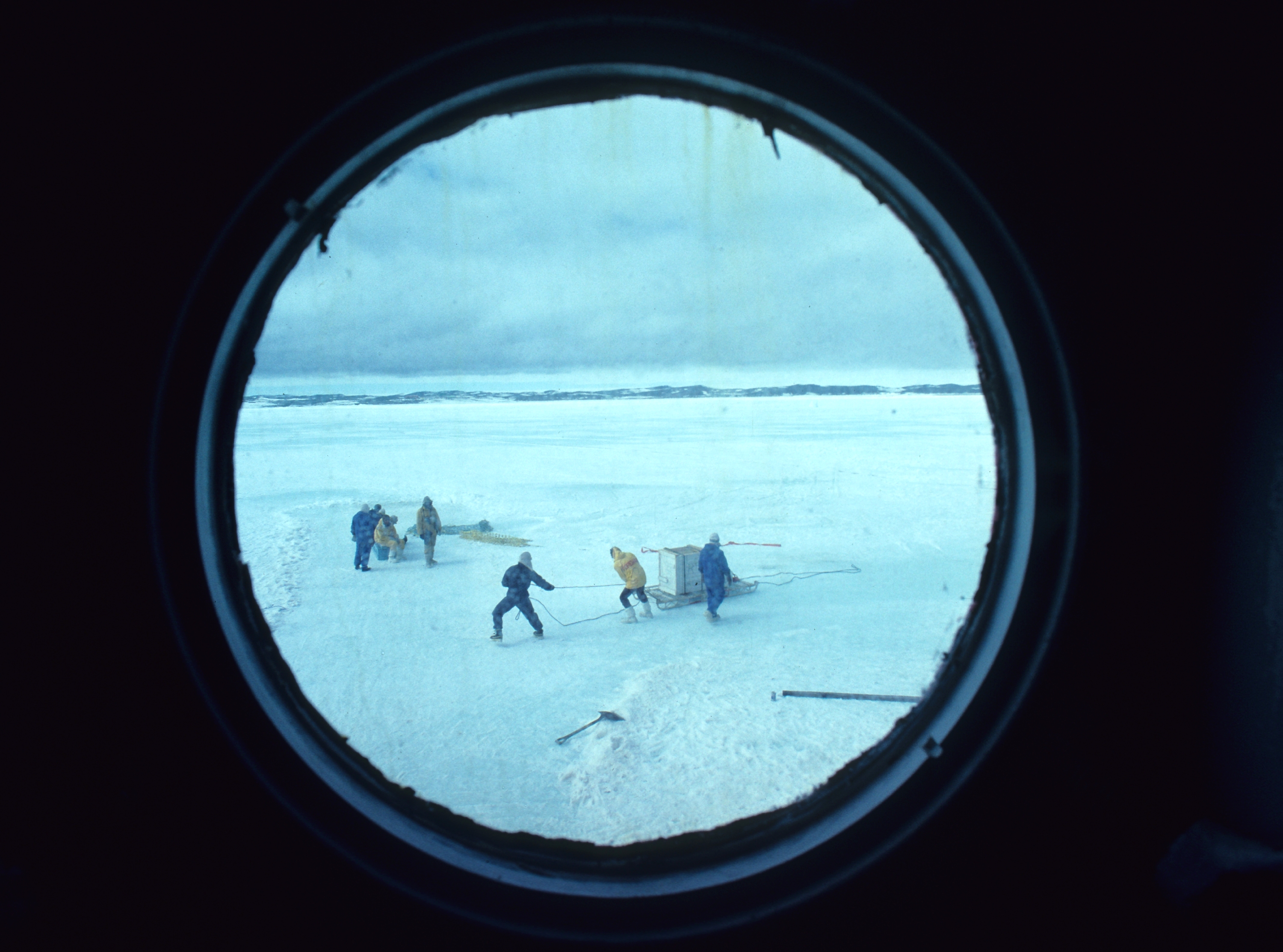 Unloading at the ice edgethrough porthole Nella Dan