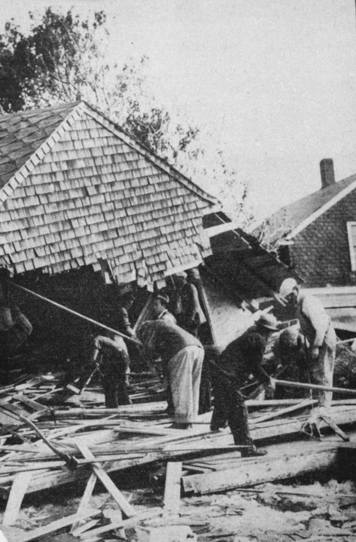 WPA workers and rescue squads search for bodies and survivors at Shawomet Beach,south of Providence