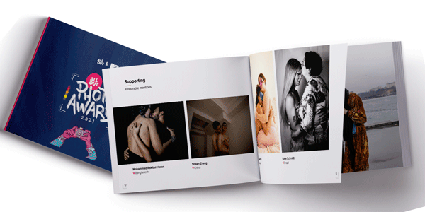 The picture shows a square blue photo book. the tiele reads All Out Photo Award