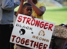 boy holding immigrant rights sign