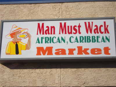 Man Must Wack  African,Caribbean Market Logo