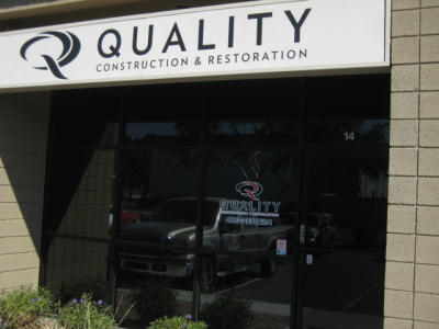 Quality Construction and Restoration Logo