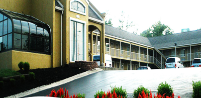 Antioch Quarters Inn and Suites Logo