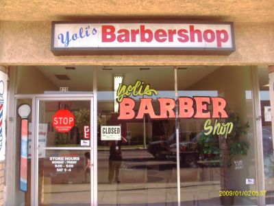 Yoli's Barber Shop Logo