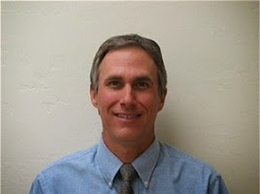 Family Care Dentistry: E. Mark Wade, DDS Logo